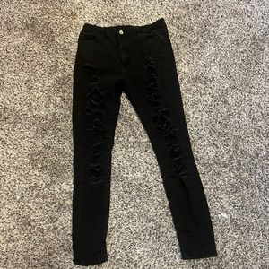 Black jeans with rips down the front.